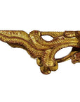 Close-up of gold and white antique Chinese temple carvings with swirling leaf patterns, pair shown.
