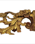 Gold and red wood antique Chinese temple carvings with intricate leaf and scroll patterns, close-up view.