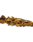 Gold-painted wood Chinese temple carvings pair with intricate leaf and floral patterns on white background, close-up.