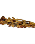 Gold-painted wood Chinese temple carvings pair with intricate leaf and floral patterns on white background, close-up.
