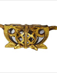 Gold-toned metal Chinese temple carvings pair with circular floral cutouts and side wings, close-up.