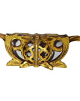 Gold-toned metal Chinese temple carvings pair with circular floral cutouts and side wings, close-up.