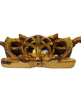 Close-up of antique Chinese temple carvings with spherical perforated wood centers and wing-like accents.