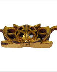 Close-up of antique Chinese temple carvings with spherical perforated wood centers and wing-like accents.
