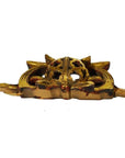 Close-up of golden antique Chinese temple carvings, ornate with pointed ends and round filigree centers.
