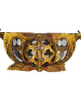 Gold-painted antique Chinese wood temple carvings with floral cutouts and ornate wing-like details, close-up view.