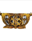 Gold-painted antique Chinese wood temple carvings with floral cutouts and ornate wing-like details, close-up view.