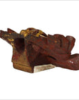Red and gold wood carvings, pair, with wing-like designs on rectangular base, Chinese antique style.