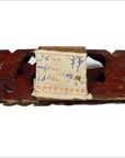 Red wood antique Chinese temple carvings with worn paper label, handwritten numbers, and Chinese text.