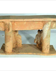 Brown terracotta Chinese town gate with two thick columns and small partial human figures beneath, 17th century.