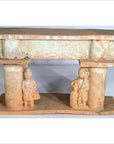 Brown terracotta town gate with two human figures, rectangular roof, flat base, 17th century Chinese style.