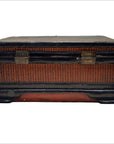 Dark wood and rattan antique Chinese box with metal clasps, close-up on white background.