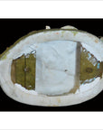 White porcelain European statue with cracks and chips on oval base, close-up from below.