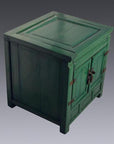 Antique green lacquer cabinet with metal hinges, two front doors, displayed against a gray background.