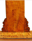 Close-up of antique lacquered elmwood chair with intricate hand-carved scrollwork, 19th century China.