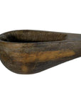 Brown hand-carved wooden Indian lute with deep rounded bowl and sturdy handle against a white background.