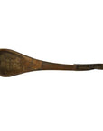 Brown hand-carved wooden Indian lute with long tapered neck against a plain white background.