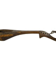 Brown hand-carved wooden Indian lute with deep bowl, curved handle, decorative holes, and hooked end for hanging.