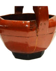 Red lacquered wood Chinese wedding basket with wide handle and black base, visible signs of age.