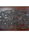 Lacquered rosewood wall plaque with hand-carved tiger and floral details, antique finish, close-up view.