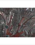 Close-up of antique lacquered rosewood wall plaque with hand-carved leaves and branches details.