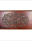 Reddish-brown lacquered rosewood wall plaque with hand-carved 19th-century floral and leaf details, close-up view.