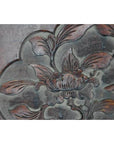Close-up of lacquered rosewood wall plaque with hand-carved floral and leaf designs, 19th century China.