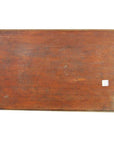 Dark rosewood wall plaque with hand-carved details, lacquered finish, worn surface, two small white stickers on right.