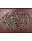 Dark rosewood wall plaque with hand-carved lacquer finish, showing intricate central floral and bird design.