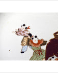 Close-up of antique hand painted Asian plate with two traditionally dressed children next to a large brown pot.