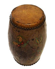 Close-up of antique hand painted Chinese drum with worn leather top and butterfly designs on wooden body.