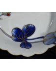 Blue and gold hand-painted Japanese Imari porcelain bowls, set of 4 with scalloped edges, close-up view.
