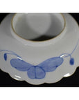 Blue and white porcelain bowls set with butterfly design and scalloped edges, hand-painted, antique Japanese Imari.