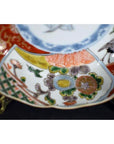 Colorful porcelain Japanese Imari bowls set of 4 with hand-painted floral, geometric patterns displayed together.