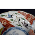 White porcelain Imari bowls with hand painted cranes, green clouds, red and gold geometric rims, set of 4.