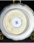 Blue and white porcelain bowl underside with central square blue mark, hand painted Japanese Imari style.