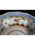 Close-up of a colorful porcelain Japanese Imari bowl with hand-painted floral and geometric patterns.