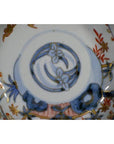 Blue, red, and gold floral Imari porcelain bowl, hand painted, antique Japanese design, seen from top view.