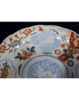 Close-up of blue, red, and gold hand painted Japanese Imari porcelain bowl with intricate designs.