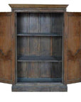 Weathered wood antique Indian cabinet with carved doors, two shelves, rustic 19th-century style, front view.