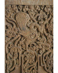Brown Sheesham wood antique Indian door with intricate floral and mythical creature carvings.