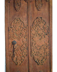 Brown wood antique Indian door with carved floral patterns, iron hardware, keyhole, and left-panel chain.