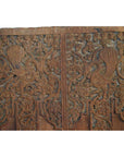 Brown Sheesham wood antique door with carved stylized birds, floral and vine patterns.