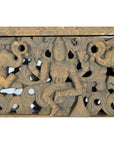 Brown sheesham wood hand-carved temple plaque with deity, elephants, and floral motifs, early 20th century.