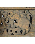 Brown Sheesham wood temple plaque with hand-carved elephant, deity, and ornate floral design, early 20th century.