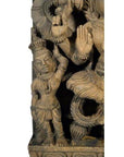 Brown sheesham wood hand-carved Indian temple decoration with standing figure in traditional attire and detailed jewelry.