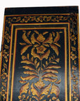 Dark wood lacquered door with gold leaf accents and floral motifs, antique Indian design, 19th-century style.