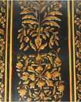 Black surface with ornate golden floral motifs and decorative border, inspired by antique Indian lacquered wood door.