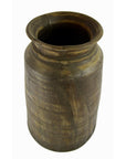 Close-up of tall brown antique Indian milk storage container vase with wide opening and slightly flared rim.