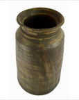 Close-up of tall brown antique Indian milk storage container vase with wide opening and slightly flared rim.